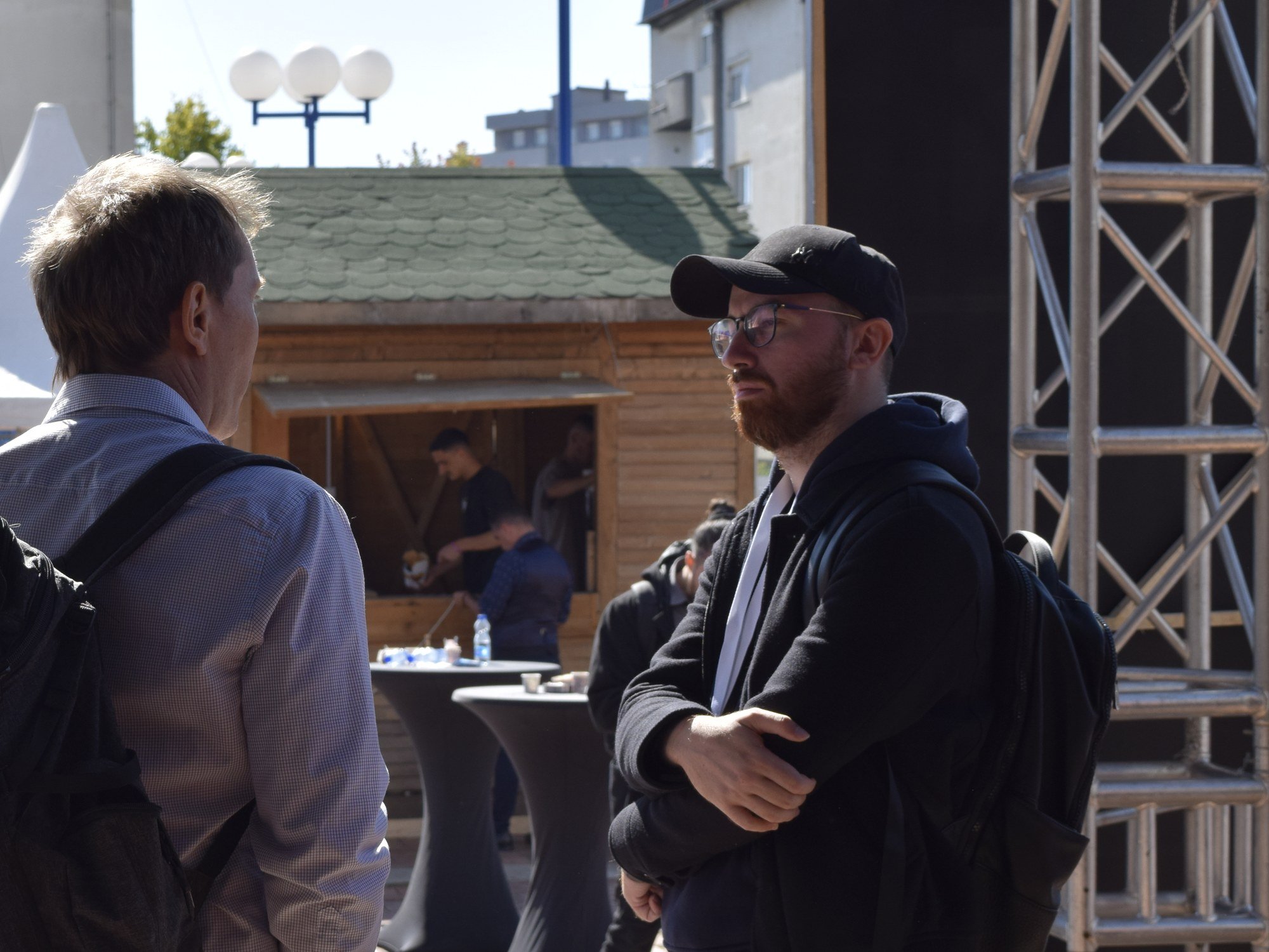 Engjell Rraklli listening during a conversation at KosICT in Prishtina